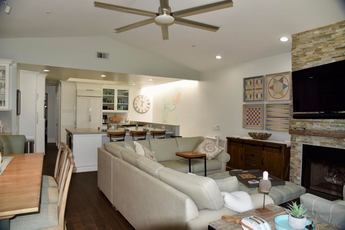 Dining room, Fireplace, Interior, Kitchen, Living room, Recessed Lighting, Stone Walls, Wood Texture Flooring