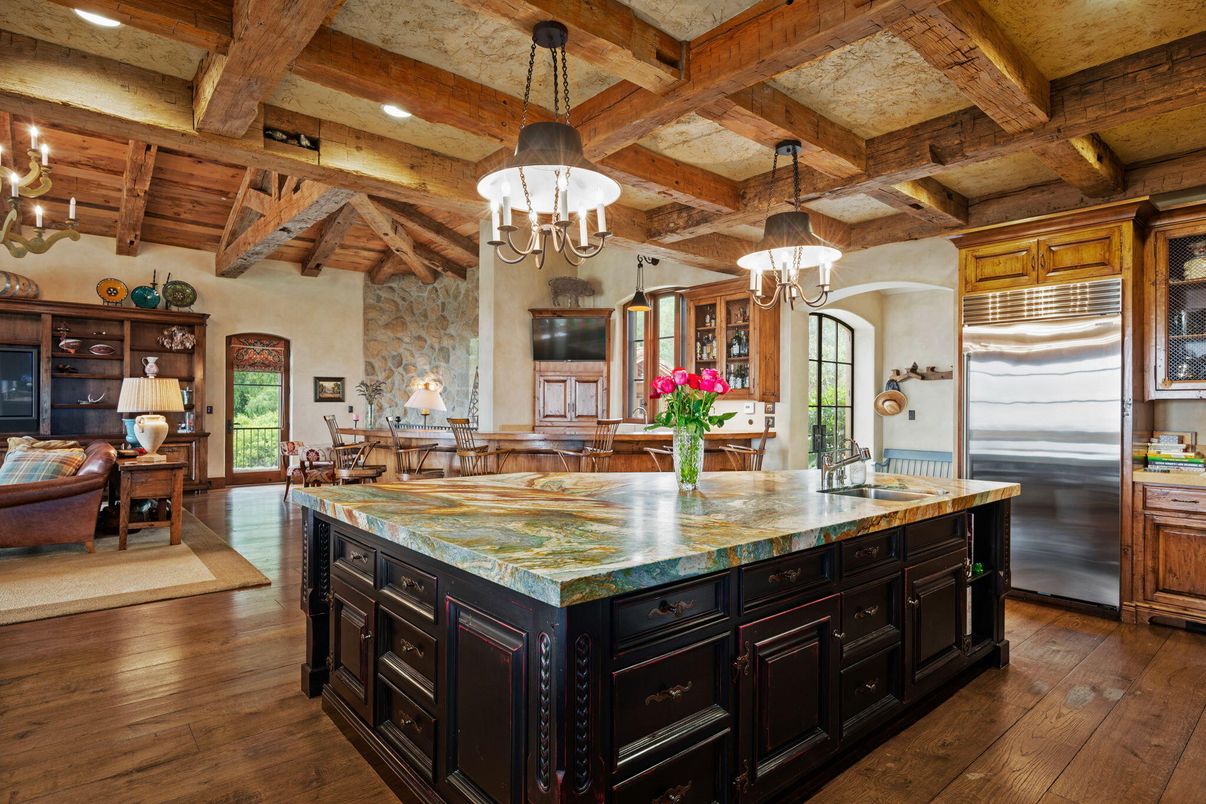 Chandelier, Interior, Kitchen, Living room, Pendant Lights, Recessed Lighting, Stainless Steel Appliances, Wooden Beams, Wooden Ceilings, Wood Texture Flooring