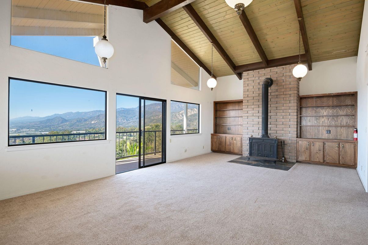 Empty room, Fireplace, Interior, Pendant Lights, Stone Walls, Wooden Beams, Wooden Ceilings