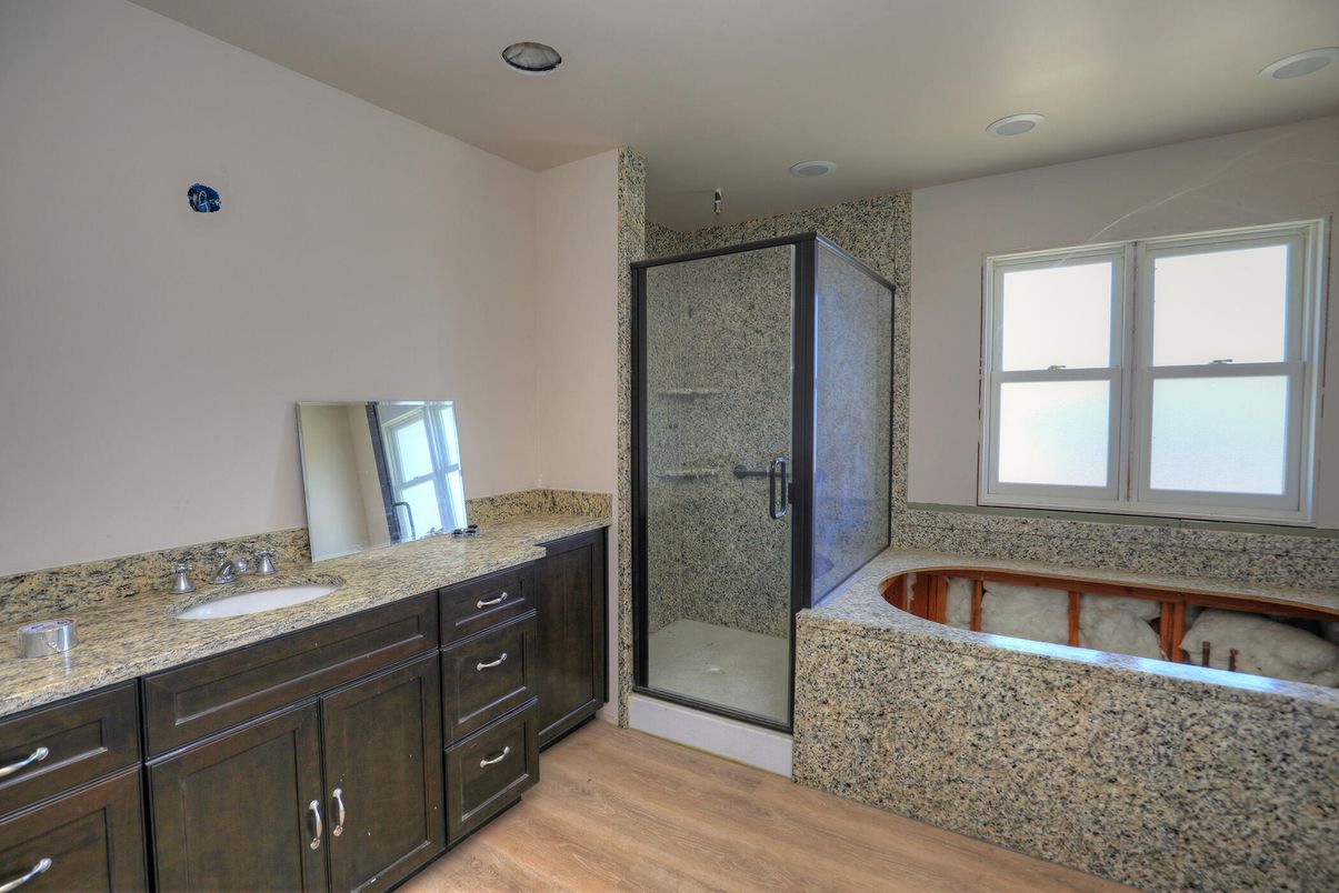 Bathroom, Dual Sink Vanities, Glass Shower, Interior, Recessed Lighting, Wood Texture Flooring