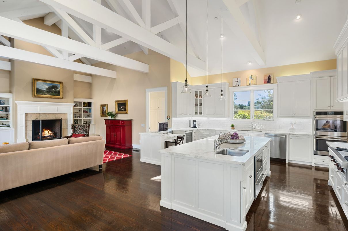 Fireplace, Interior, Kitchen, Living room, Pendant Lights, Recessed Lighting, Stainless Steel Appliances, Wood Texture Flooring