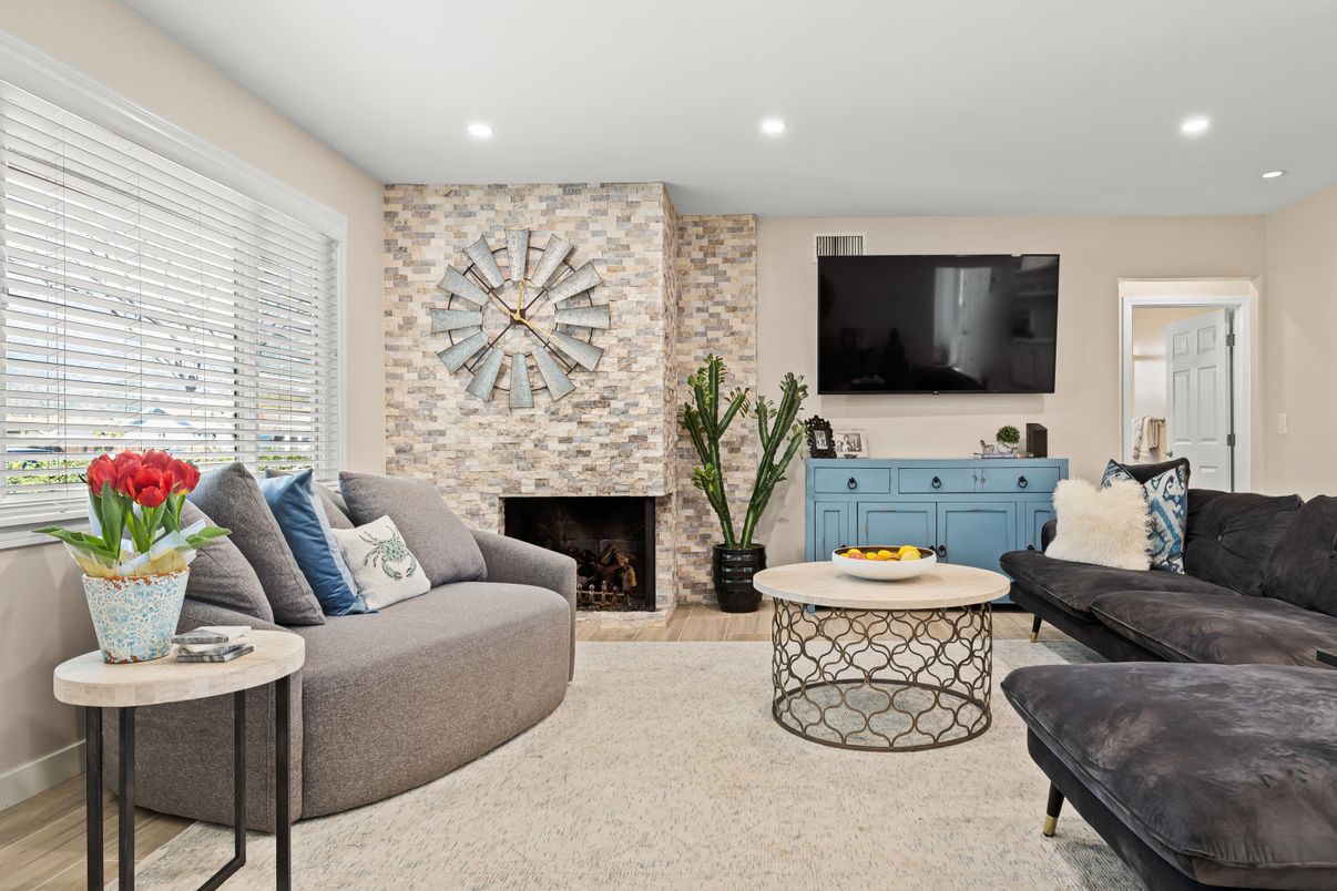 Fireplace, Interior, Living room, Recessed Lighting, Stone Walls, Wood Texture Flooring