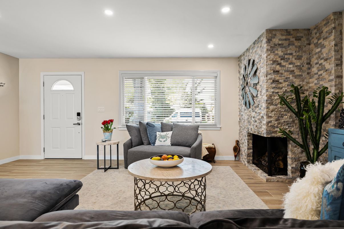 Fireplace, Interior, Living room, Recessed Lighting, Stone Walls, Wood Texture Flooring