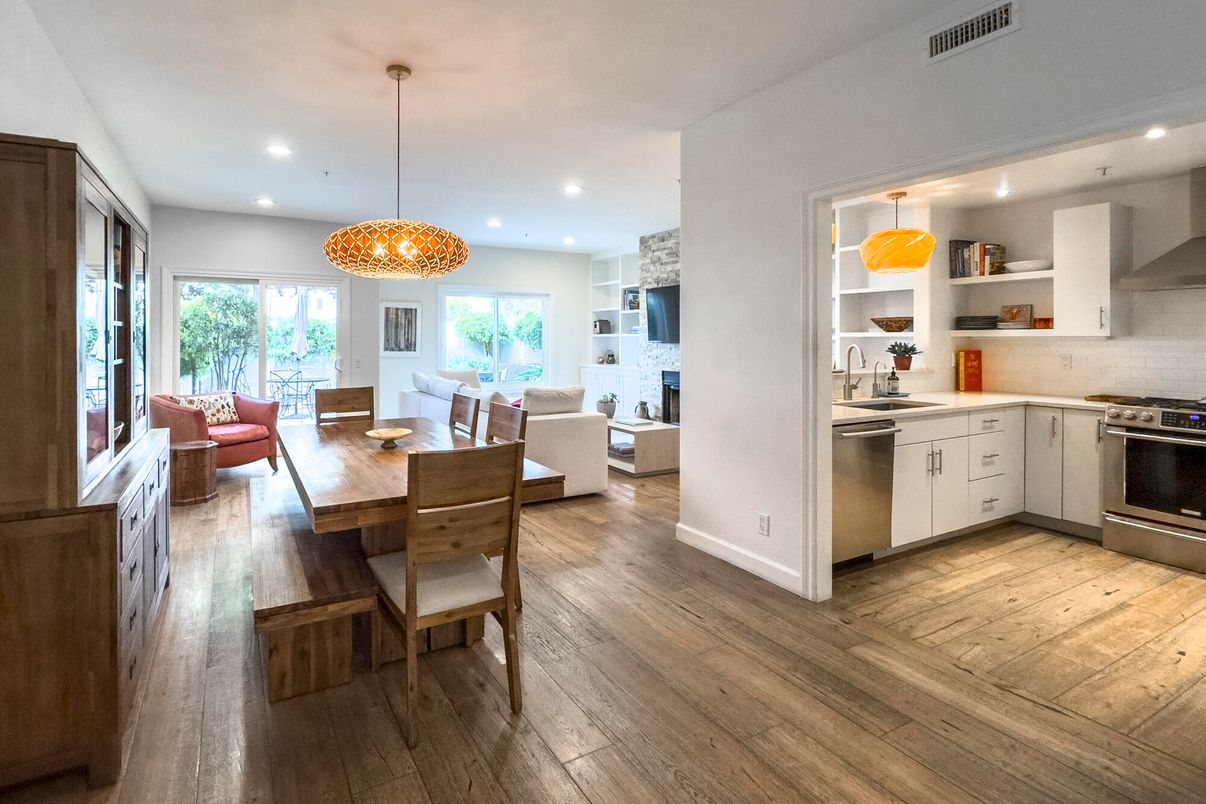 Dining room, Fireplace, Interior, Kitchen, Living room, Pendant Lights, Recessed Lighting, Stainless Steel Appliances, Wood Texture Flooring