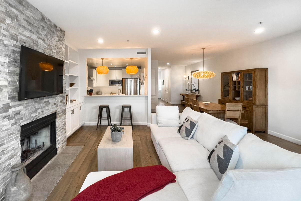 Dining room, Fireplace, Interior, Kitchen, Living room, Pendant Lights, Recessed Lighting, Stainless Steel Appliances, Stone Walls, Wood Texture Flooring