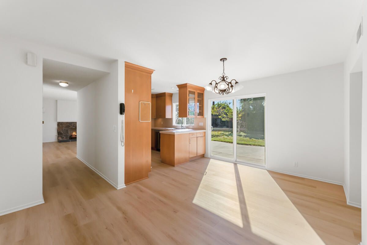 Empty room, Fireplace, Interior, Kitchen, Pendant Lights, Wood Texture Flooring