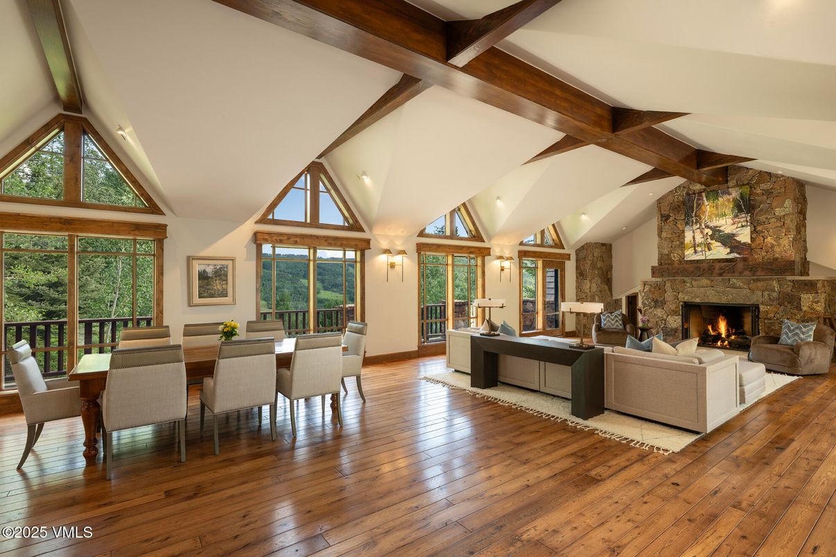 Dining room, Fireplace, Interior, Living room, Recessed Lighting, Stone Walls, Wooden Beams, Wood Texture Flooring