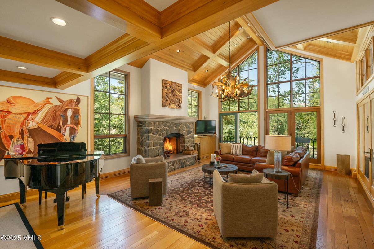 Chandelier, Fireplace, Interior, Living room, Piano, Recessed Lighting, Wooden Beams, Wooden Ceilings, Wood Texture Flooring