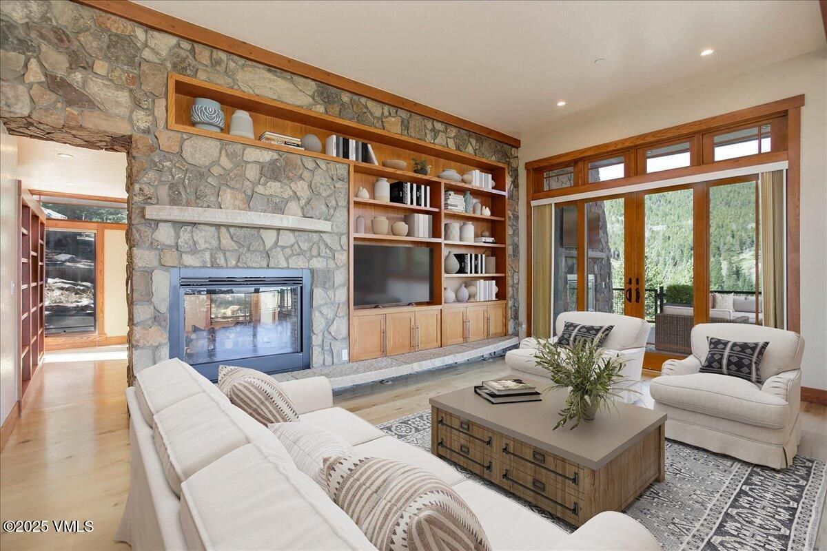 Fireplace, Interior, Living room, Recessed Lighting, Stone Walls, Wood Texture Flooring