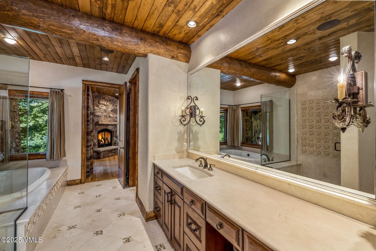 Bathroom, Dual Sink Vanities, Fireplace, Glass Shower, Interior, Marble, Recessed Lighting, Wooden Beams, Wooden Ceilings