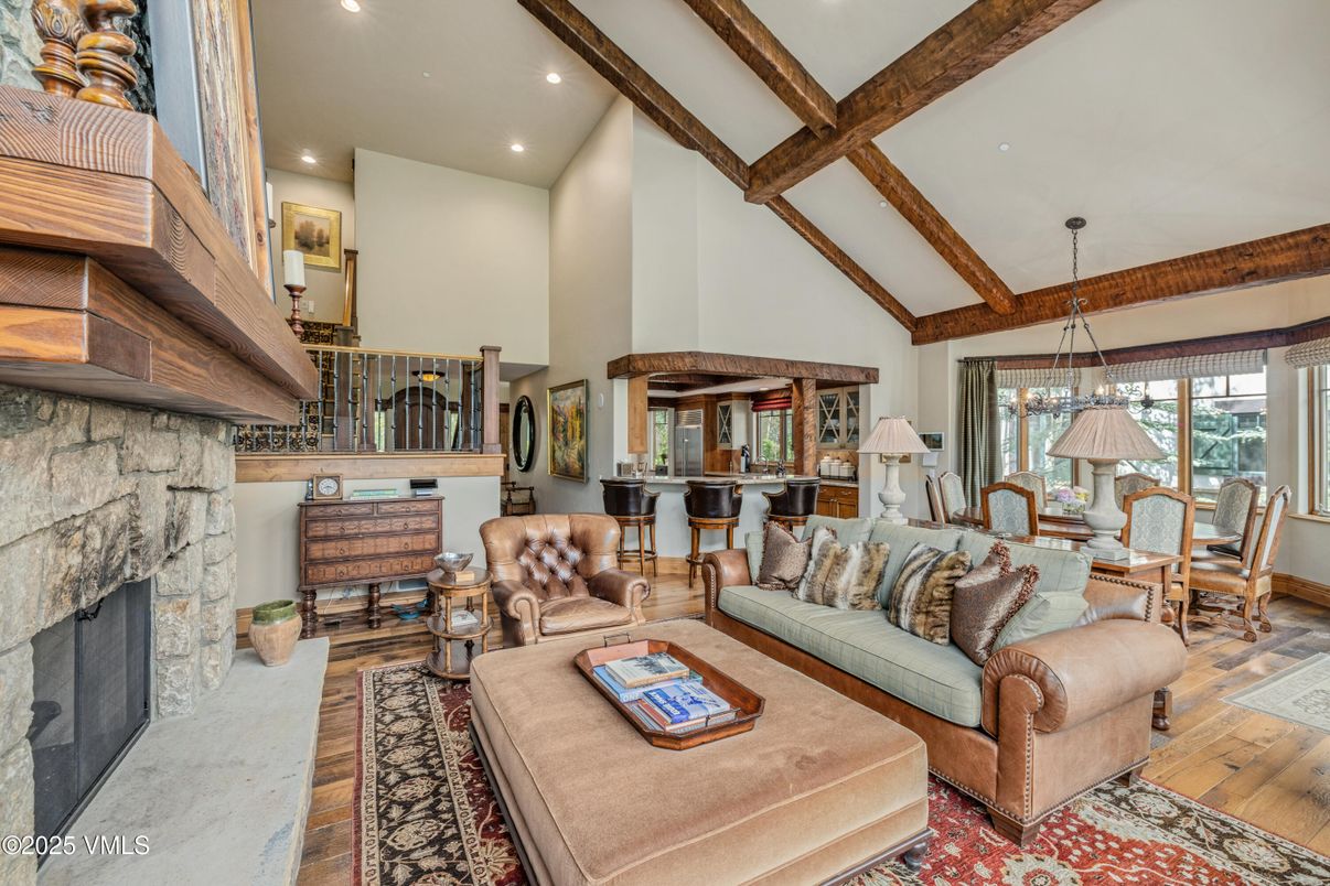 Dining room, Fireplace, Interior, Living room, Pendant Lights, Recessed Lighting, Stone Walls, Wooden Beams, Wood Texture Flooring