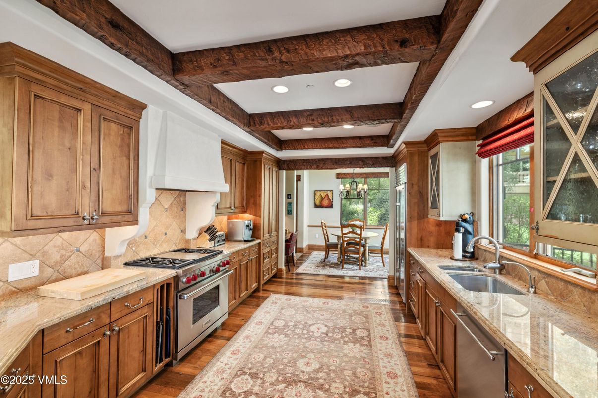 Chandelier, Dining room, Interior, Kitchen, Recessed Lighting, Stainless Steel Appliances, Wooden Beams, Wood Texture Flooring