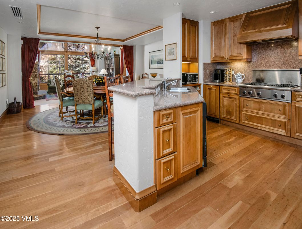 Chandelier, Dining room, Interior, Kitchen, Recessed Lighting, Stainless Steel Appliances, Wood Texture Flooring