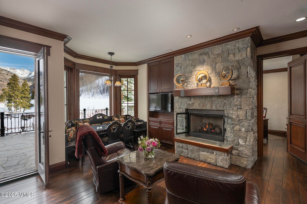 Dining room, Fireplace, Interior, Living room, Pendant Lights, Recessed Lighting, Stone Walls, Wood Texture Flooring