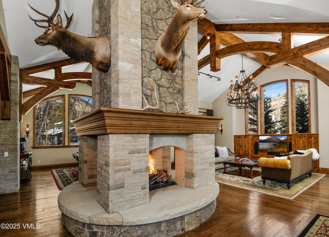 Chandelier, Fireplace, Interior, Living room, Stone Walls, Wooden Beams, Wood Texture Flooring