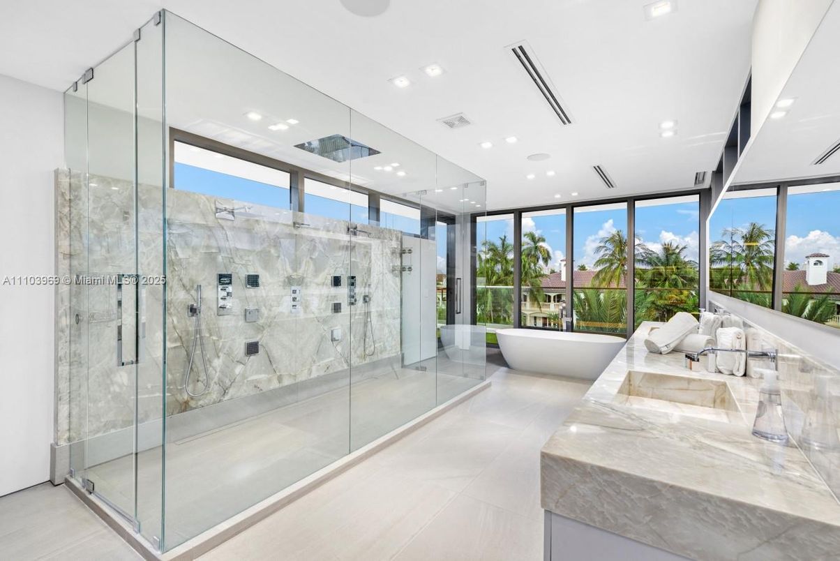 Bathroom, Dual Sink Vanities, Free Standing Baths, Glass Shower, Interior, Marble Walls, Recessed Lighting