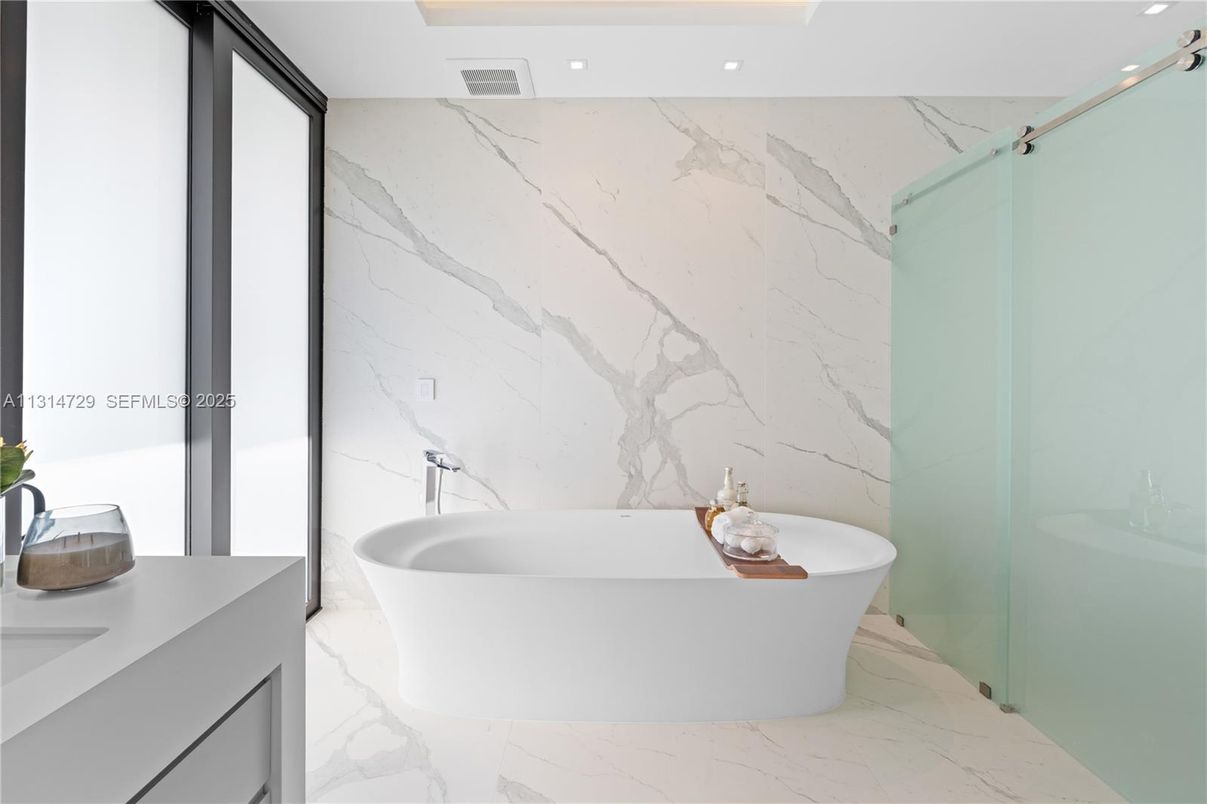 Bathroom, Free Standing Baths, Glass Shower, Interior, Marble, Marble Walls, Recessed Lighting