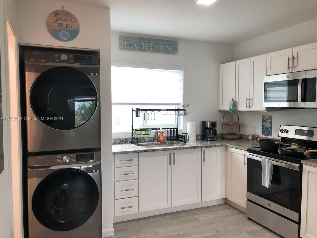 Interior, Kitchen, Recessed Lighting, Utility Closets, Washer, Wood Texture Flooring