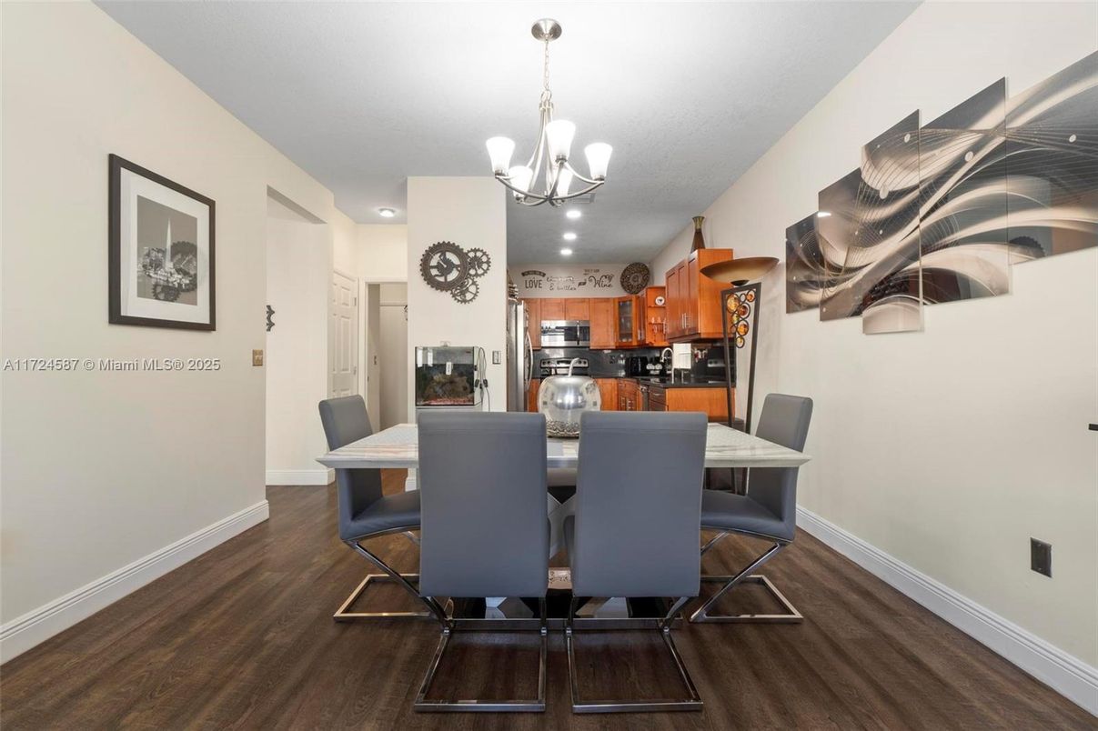 Chandelier, Dining room, Interior, Kitchen, Recessed Lighting, Stainless Steel Appliances, Wood Texture Flooring