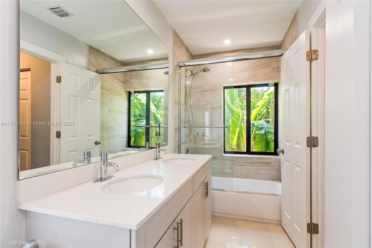 Bathroom, Dual Sink Vanities, Glass Shower, Interior, Marble Walls, Recessed Lighting