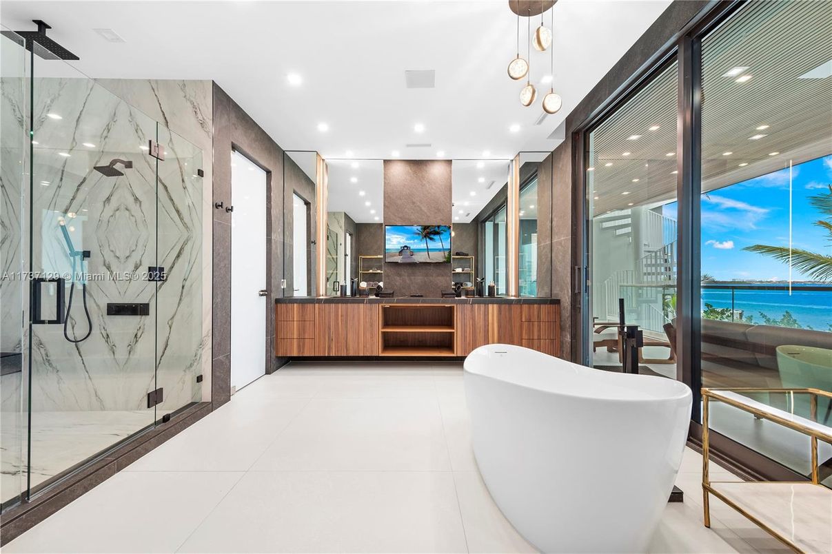 Bathroom, Dual Sink Vanities, Free Standing Baths, Glass Shower, Interior, Marble Walls, Pendant Lights, Recessed Lighting, Water