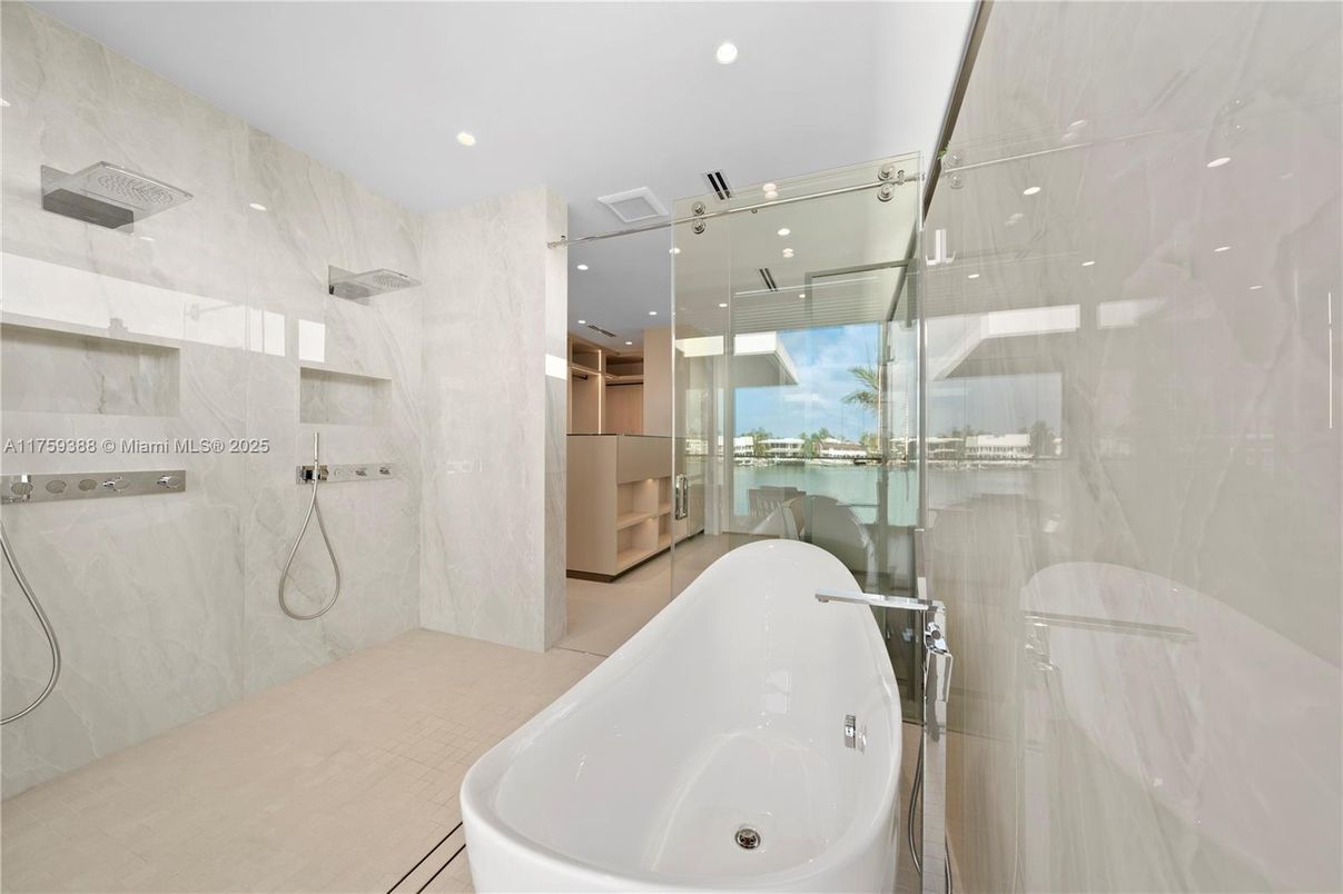 Bathroom, Free Standing Baths, Glass Shower, Interior, Marble Walls, Recessed Lighting, Water
