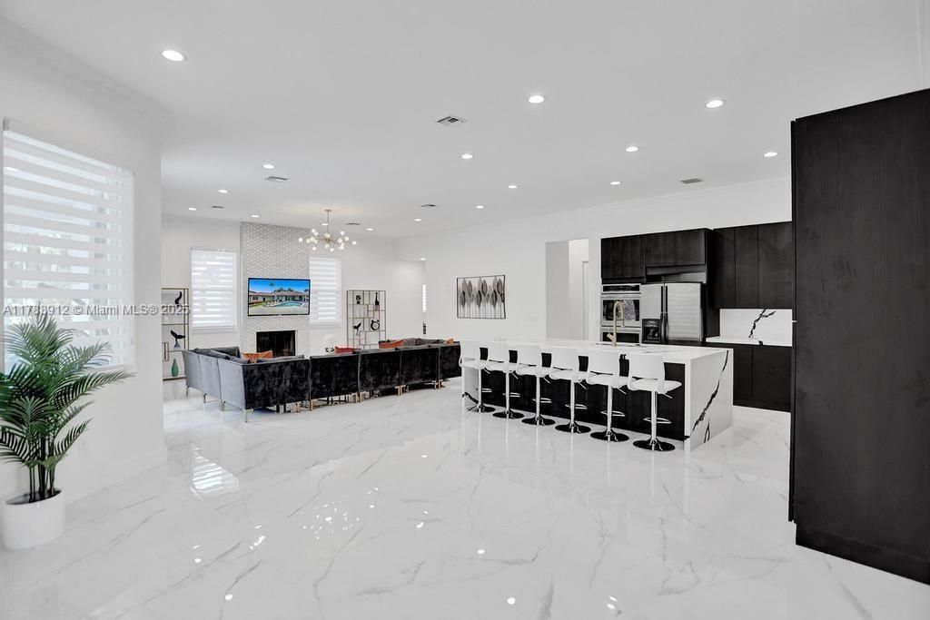 Fireplace, Interior, Kitchen, Living room, Marble, Pendant Lights, Recessed Lighting, Stainless Steel Appliances