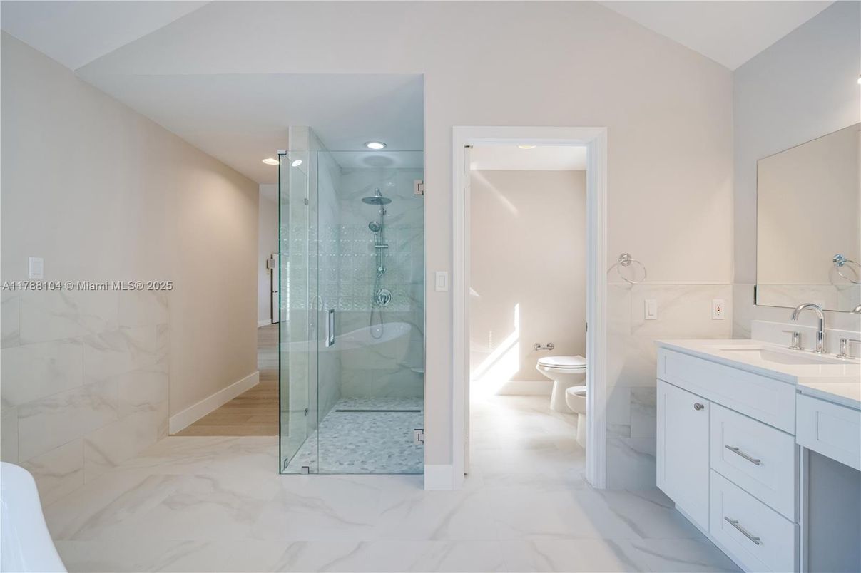 Bathroom, Dual Sink Vanities, Glass Shower, Interior, Marble, Marble Walls, Recessed Lighting