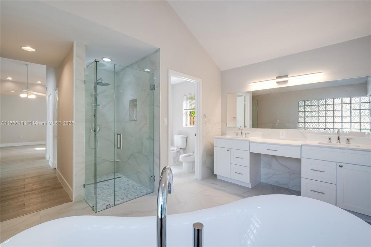 Bathroom, Dual Sink Vanities, Free Standing Baths, Glass Shower, Interior, Marble Walls, Recessed Lighting