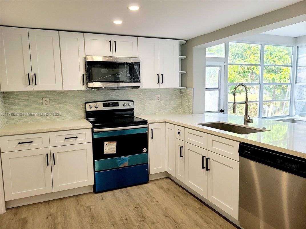 Interior, Kitchen, Recessed Lighting, Stainless Steel Appliances, Wood Texture Flooring