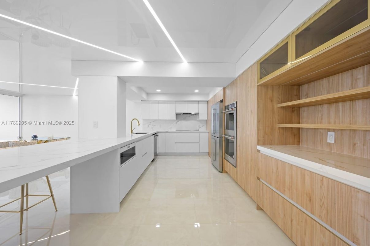 Interior, Kitchen, Marble Walls, Recessed Lighting, Stainless Steel Appliances