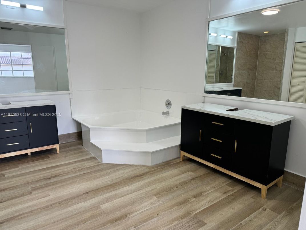 Bathroom, Dual Sink Vanities, Free Standing Baths, Interior, Recessed Lighting, Wood Texture Flooring