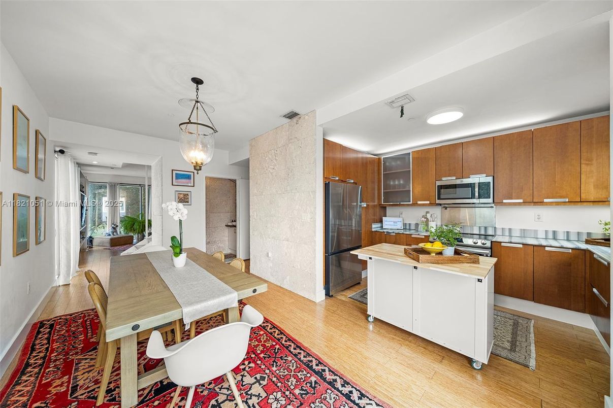 Dining room, Interior, Kitchen, Pendant Lights, Recessed Lighting, Stainless Steel Appliances, Wood Texture Flooring