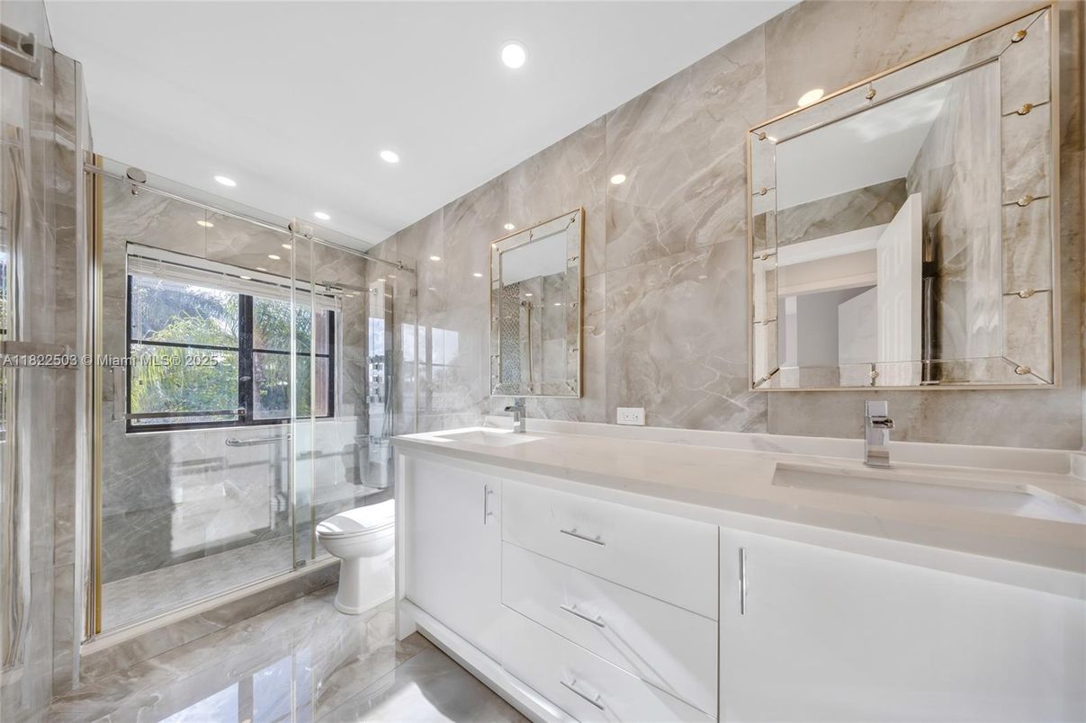 Bathroom, Dual Sink Vanities, Glass Shower, Interior, Marble Walls, Recessed Lighting