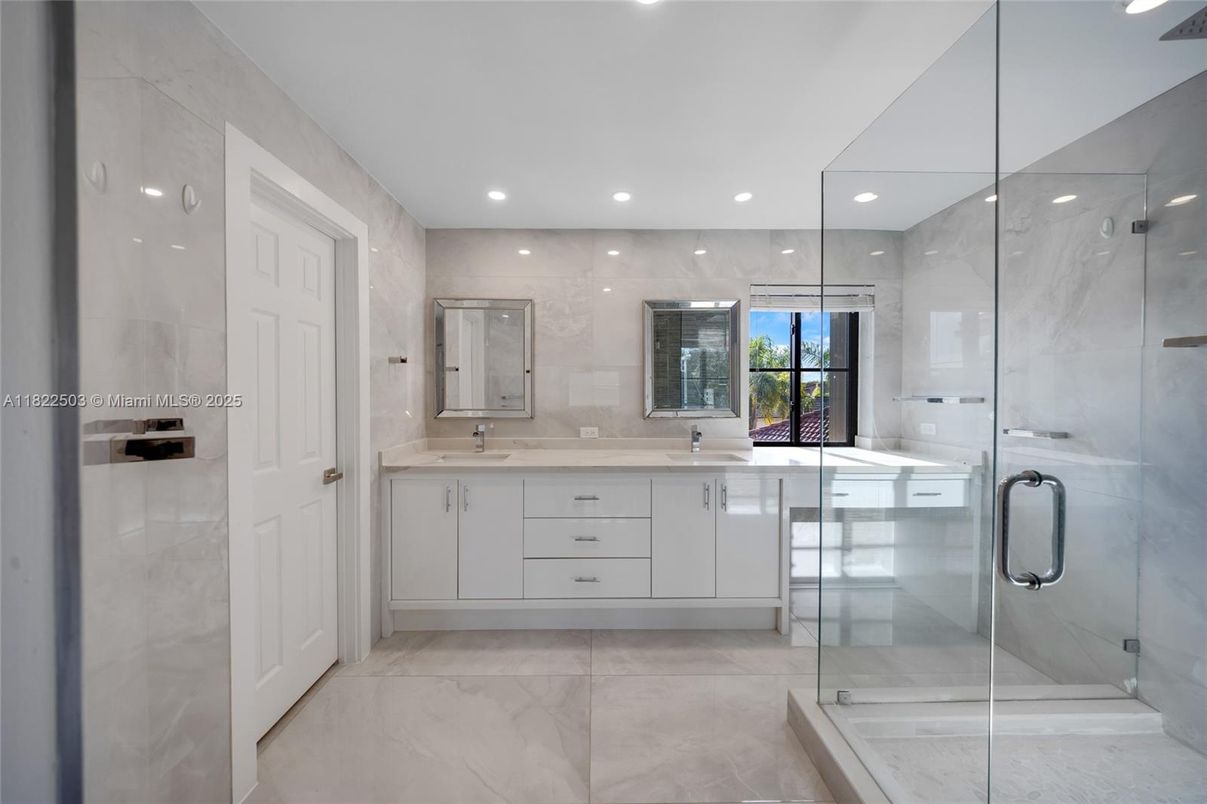 Bathroom, Dual Sink Vanities, Glass Shower, Interior, Marble, Marble Walls, Recessed Lighting