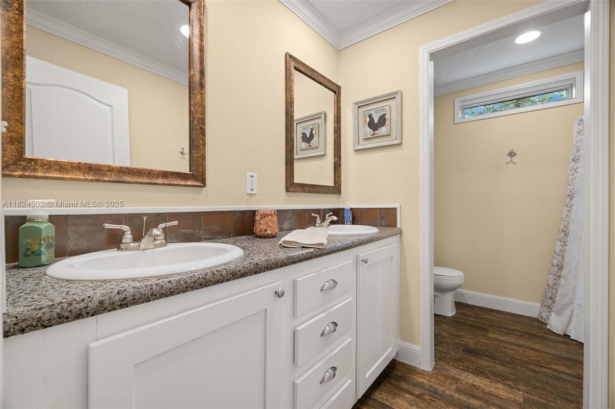 Bathroom, Dual Sink Vanities, Interior, Recessed Lighting, Wood Texture Flooring