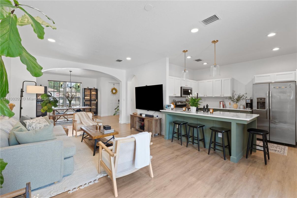 Chandelier, Dining room, Interior, Kitchen, Living room, Pendant Lights, Recessed Lighting, Stainless Steel Appliances, Wood Texture Flooring
