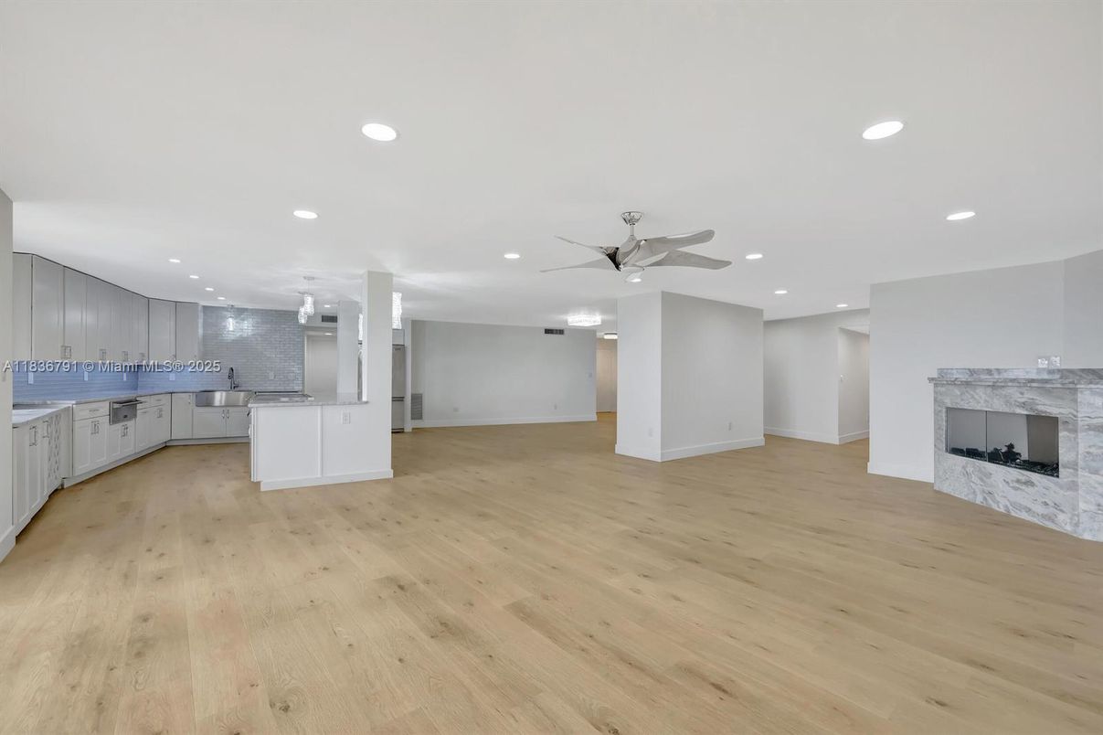 Empty room, Fireplace, Interior, Kitchen, Recessed Lighting, Wood Texture Flooring