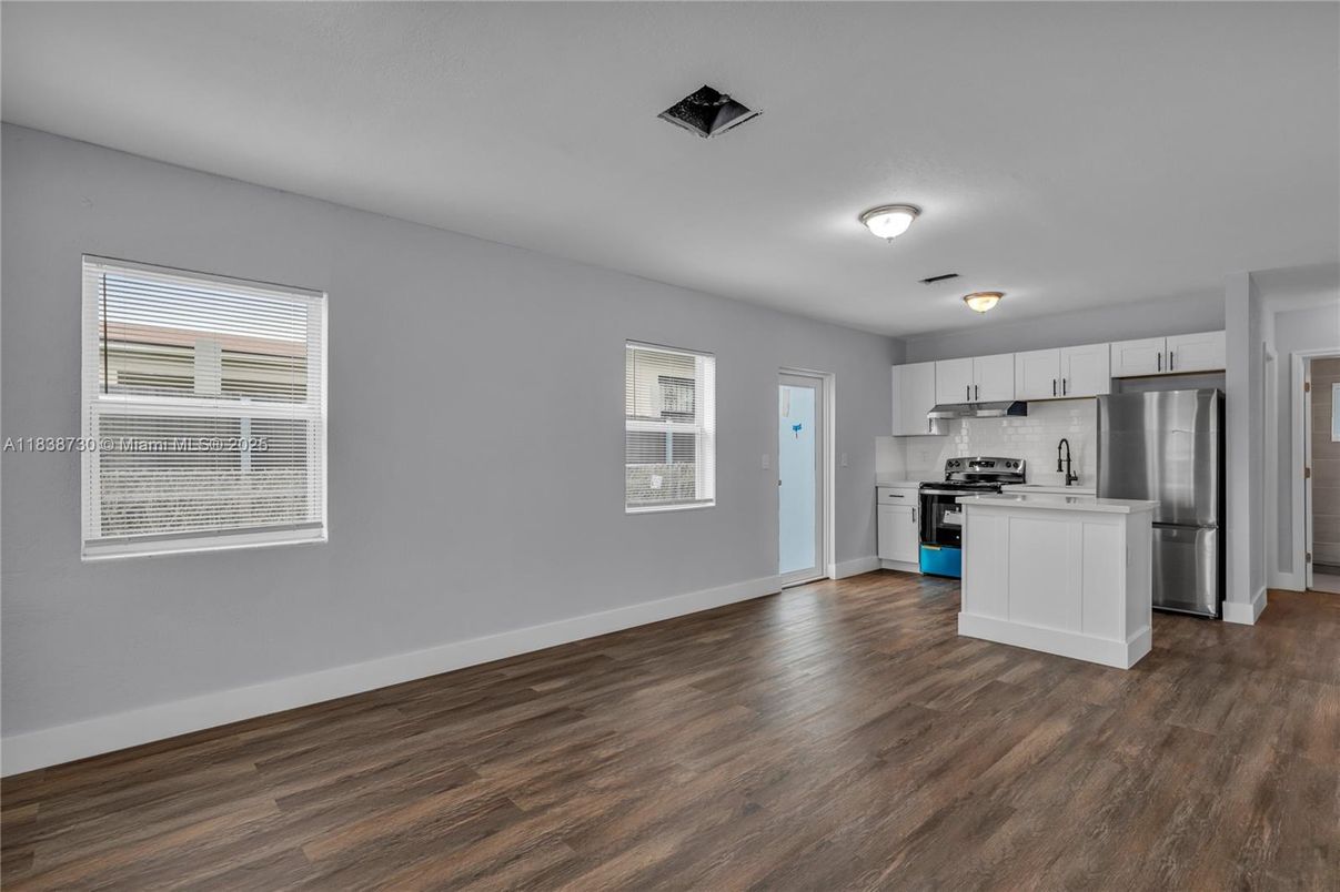 Empty room, Interior, Kitchen, Stainless Steel Appliances, Wood Texture Flooring