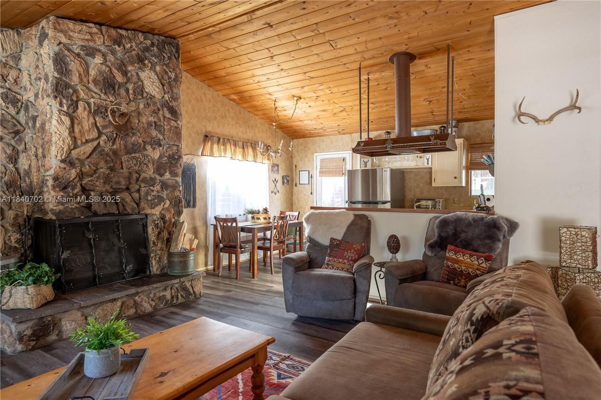 Dining room, Fireplace, Interior, Kitchen, Living room, Stone Walls, Wooden Ceilings, Wood Texture Flooring