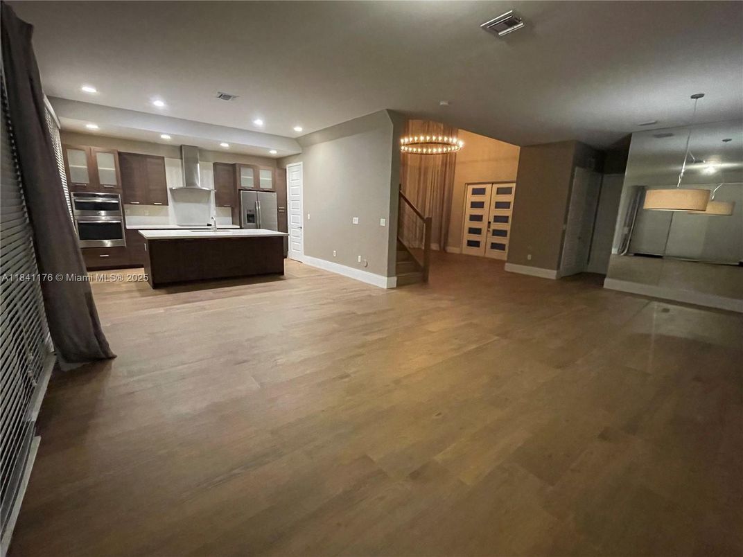 Chandelier, Interior, Kitchen, Pendant Lights, Recessed Lighting, Stainless Steel Appliances, Wood Texture Flooring