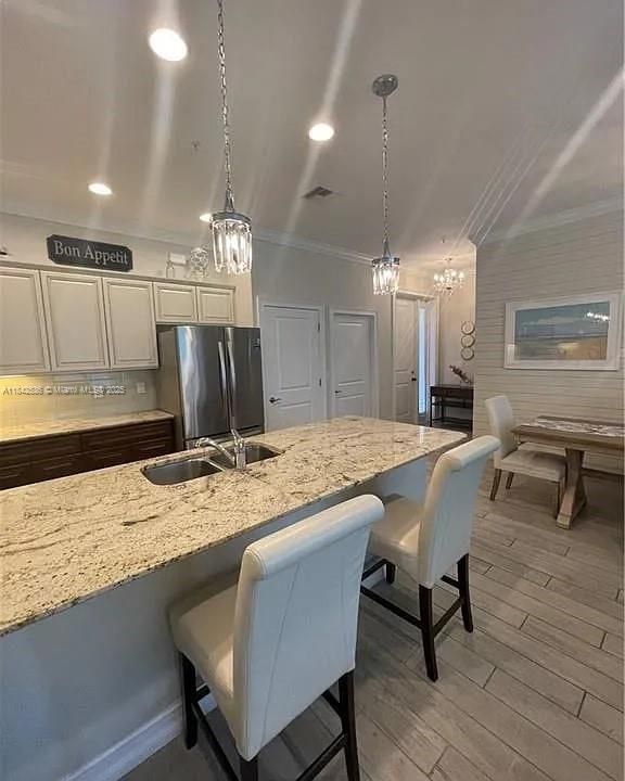 Chandelier, Dining room, Interior, Kitchen, Pendant Lights, Recessed Lighting, Stainless Steel Appliances, Wood Texture Flooring
