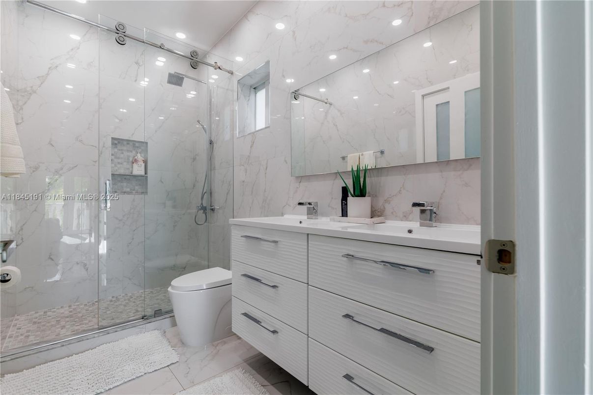 Bathroom, Dual Sink Vanities, Glass Shower, Interior, Marble, Marble Walls, Recessed Lighting