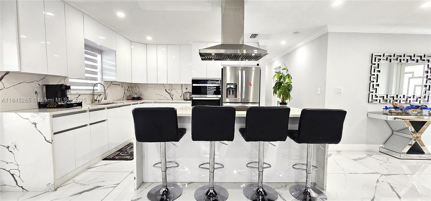 Interior, Kitchen, Marble, Marble Walls, Recessed Lighting, Stainless Steel Appliances