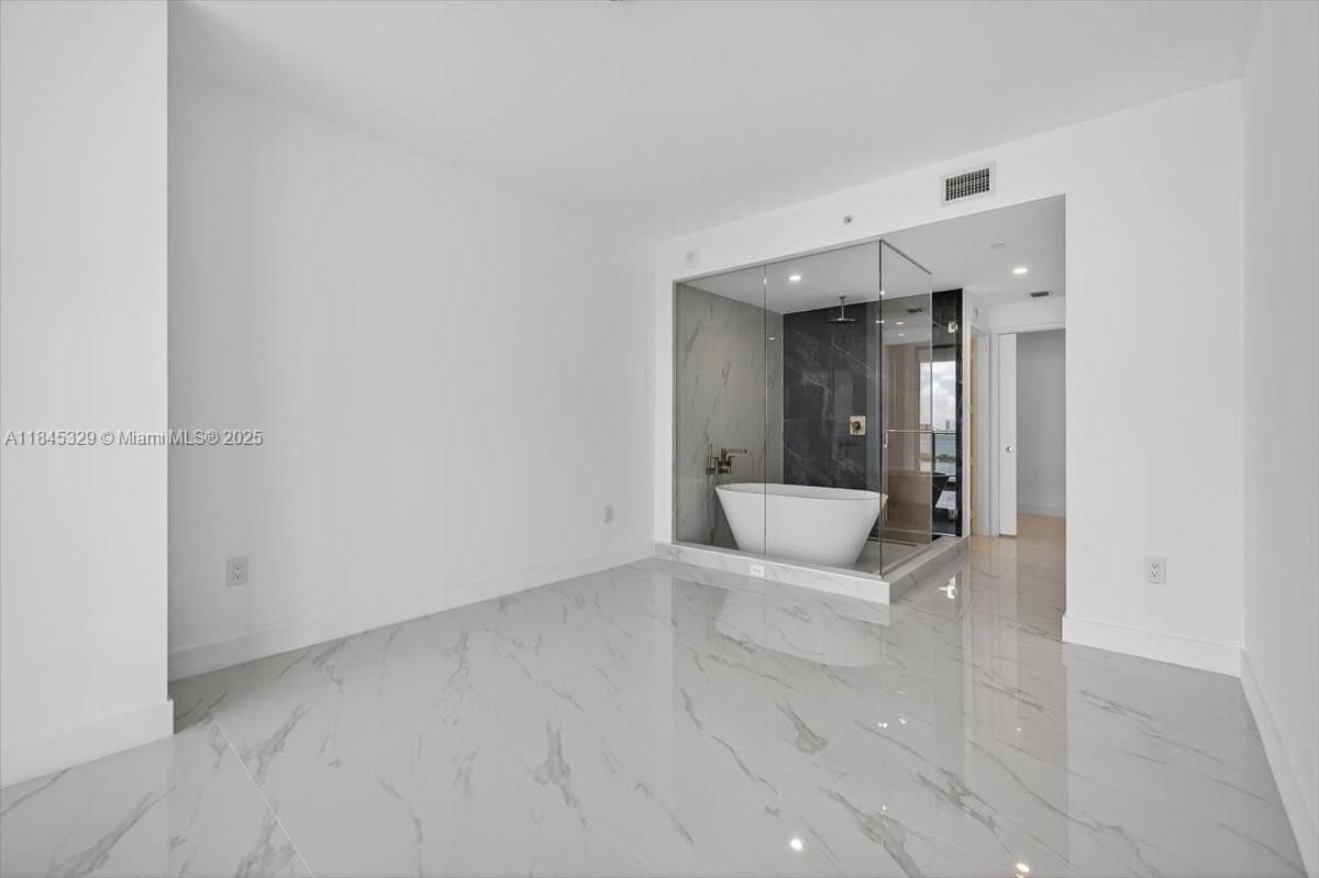 Bathroom, Free Standing Baths, Glass Shower, Interior, Marble, Marble Walls, Recessed Lighting