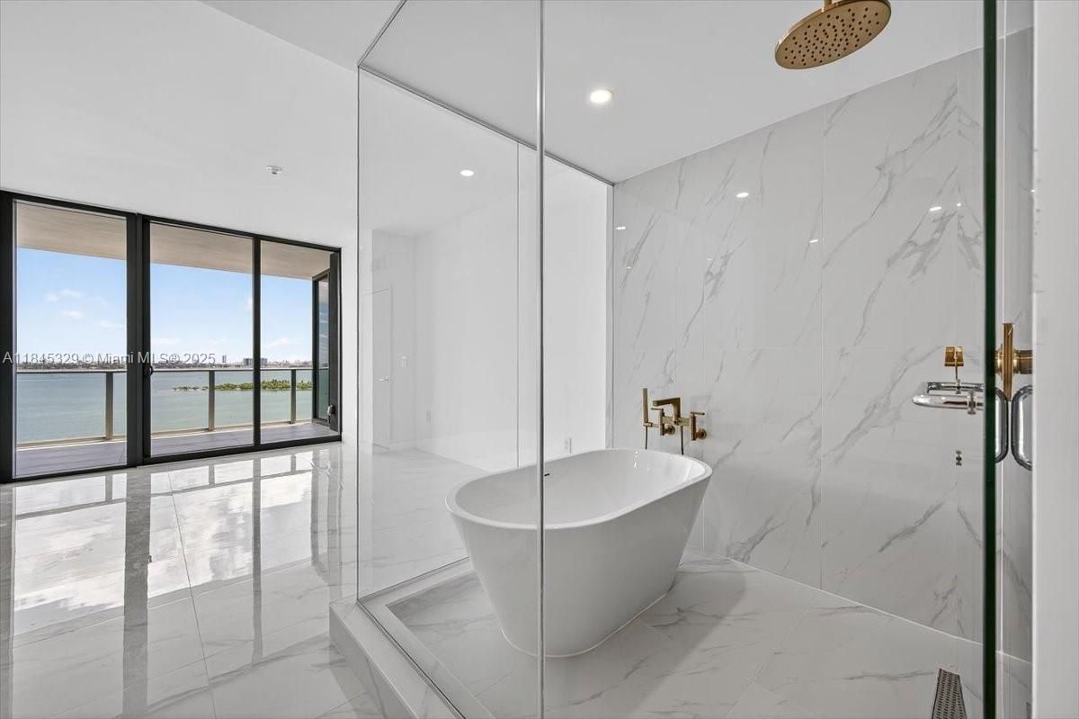 Bathroom, Free Standing Baths, Glass Shower, Interior, Marble, Marble Walls, Recessed Lighting, Water