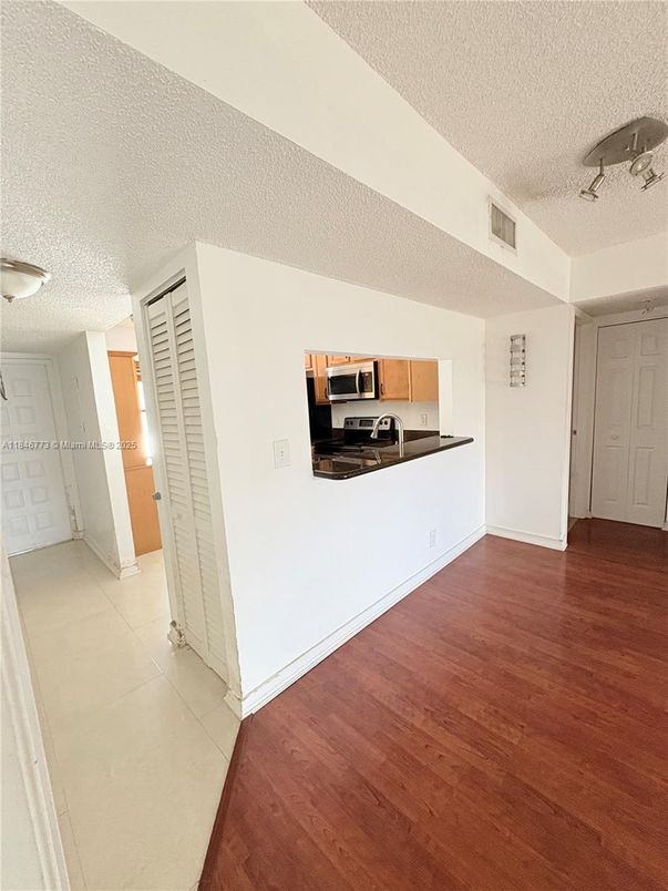 Empty room, Interior, Kitchen, Stainless Steel Appliances, Wood Texture Flooring
