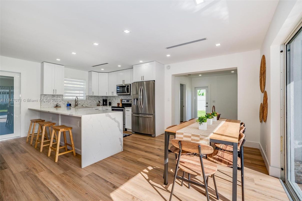 Dining room, Interior, Kitchen, Recessed Lighting, Stainless Steel Appliances, Wood Texture Flooring