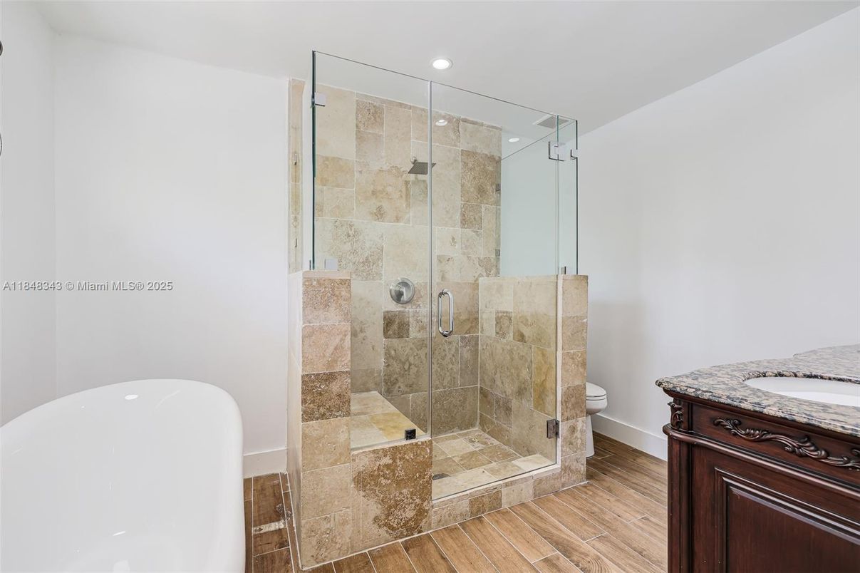 Bathroom, Free Standing Baths, Glass Shower, Interior, Recessed Lighting, Wood Texture Flooring