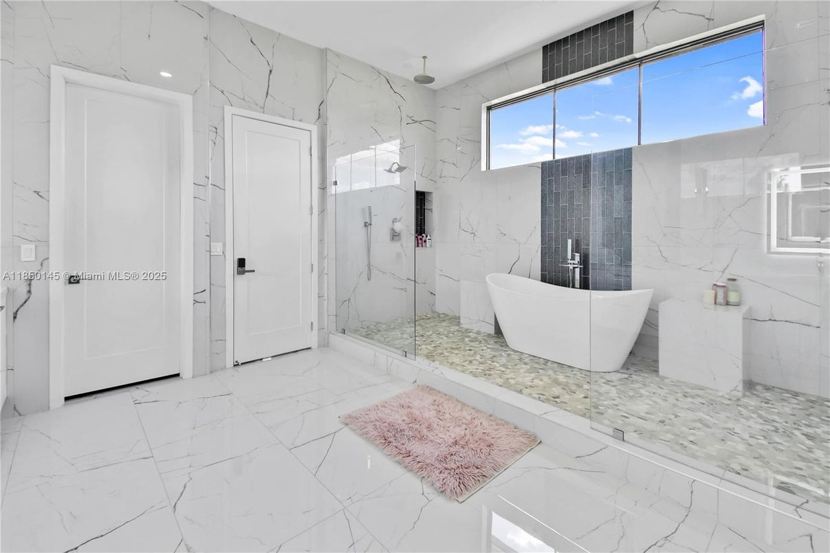 Bathroom, Free Standing Baths, Glass Shower, Interior, Marble, Marble Walls, Recessed Lighting